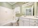 Bathroom features a combined shower and tub, with a white vanity at 3701 Baron Cooper Pass # 303, Raleigh, NC 27612