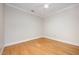 Bright bedroom features hardwood floors and a ceiling fan at 3701 Baron Cooper Pass # 303, Raleigh, NC 27612