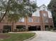 Exterior view of a brick apartment building with covered parking at 3701 Baron Cooper Pass # 303, Raleigh, NC 27612