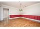 Dining room with hardwood floors and colorful lighting fixture at 3701 Baron Cooper Pass # 303, Raleigh, NC 27612