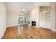 Spacious living room featuring a fireplace, built-in shelving, and a ceiling fan at 3701 Baron Cooper Pass # 303, Raleigh, NC 27612