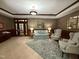 Cozy lobby featuring a comfortable sofa, armchairs, and elegant decor at 3701 Baron Cooper Pass # 303, Raleigh, NC 27612