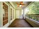 Covered porch with decorative railing and ceiling fan at 3701 Baron Cooper Pass # 303, Raleigh, NC 27612