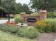 Community sign with flowers and greenery at 3701 Baron Cooper Pass # 303, Raleigh, NC 27612