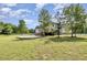 Spacious backyard features a wooden deck and patio, perfect for outdoor entertaining at 407 Kadir Womble Dr, New Hill, NC 27562