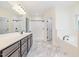 Spacious bathroom with dual vanity, a soaking tub, and a separate shower at 407 Kadir Womble Dr, New Hill, NC 27562