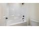 Bathroom features a bathtub and shower combination at 407 Kadir Womble Dr, New Hill, NC 27562