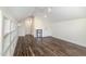 Spacious room featuring hardwood floors, mini fridge, sink, and built in shelves at 407 Kadir Womble Dr, New Hill, NC 27562