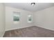 Large bedroom with two windows offering an abundance of natural light at 407 Kadir Womble Dr, New Hill, NC 27562