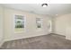 Bright and open bedroom features large windows and a door to the outside at 407 Kadir Womble Dr, New Hill, NC 27562