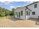 Exterior view from a deck with steps leading to an enclosed porch at 407 Kadir Womble Dr, New Hill, NC 27562