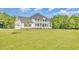 Charming two-story home with landscaped yard and an attached garage at 407 Kadir Womble Dr, New Hill, NC 27562