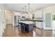 Bright kitchen with a center island, stainless steel appliances, and plenty of cabinet space at 407 Kadir Womble Dr, New Hill, NC 27562