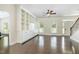 Bright living room featuring hardwood floors, built-in bookshelves, and lots of natural light at 407 Kadir Womble Dr, New Hill, NC 27562