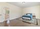 Bright bedroom featuring hardwood floors and a view into the connected bathroom at 407 Kadir Womble Dr, New Hill, NC 27562
