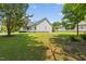 A spacious backyard with green grass and a home that features a lovely patio at 4111 Branchwood Dr, Durham, NC 27705