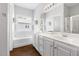 Bright bathroom with dual vanity, soaking tub, and separate shower at 4111 Branchwood Dr, Durham, NC 27705