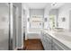 Bright bathroom with double vanity, soaking tub, separate shower, and wood flooring at 4111 Branchwood Dr, Durham, NC 27705