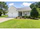 Charming single-story home with a well-manicured lawn, two-car garage, and inviting front porch at 4111 Branchwood Dr, Durham, NC 27705