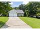 Charming home featuring a two-car garage, well-maintained lawn, and inviting front porch at 4111 Branchwood Dr, Durham, NC 27705