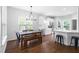 Bright kitchen and dining area featuring hardwood floors, modern appliances, and an open concept layout at 4111 Branchwood Dr, Durham, NC 27705