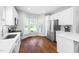 Bright kitchen with stainless steel appliances, marble backsplash, and a bay window at 4111 Branchwood Dr, Durham, NC 27705