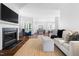 Open-concept living area with hardwood floors, dining area, kitchen, and comfortable seating at 4111 Branchwood Dr, Durham, NC 27705