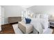 Spacious main bedroom with an ottoman at the foot of the bed and a light color scheme at 4111 Branchwood Dr, Durham, NC 27705