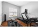 Bright workout room with a treadmill, weight bench, and natural light at 4111 Branchwood Dr, Durham, NC 27705
