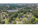 Beautiful aerial view of the community with mature trees and a tranquil lake nearby at 4140 Willow Haven Ct, Raleigh, NC 27616