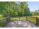 Enjoy the peaceful outdoor living on this backyard deck, surrounded by lush greenery and mature trees at 4140 Willow Haven Ct, Raleigh, NC 27616