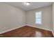 A serene bedroom with hardwood floors and a window that invites natural light at 4140 Willow Haven Ct, Raleigh, NC 27616