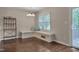 Cozy dining area with built-in bench seating, hardwood floors, and stylish lighting at 4140 Willow Haven Ct, Raleigh, NC 27616