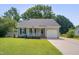 Charming home with a well-manicured lawn, inviting porch, and attached single-car garage at 4140 Willow Haven Ct, Raleigh, NC 27616