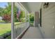 Spacious covered front porch with a white railing, perfect for relaxing at 4140 Willow Haven Ct, Raleigh, NC 27616