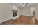 Bright living room with a decorative fireplace and hardwood flooring at 4140 Willow Haven Ct, Raleigh, NC 27616
