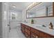Bathroom features a double sink vanity and tiled floor at 419 Mabry Rd, Angier, NC 27501