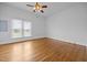 Bright bedroom showcasing hardwood floors, natural light, and ample space at 419 Mabry Rd, Angier, NC 27501