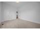 Bedroom featuring neutral carpet, a closet and a door to another room at 419 Mabry Rd, Angier, NC 27501
