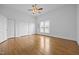 Large bedroom with hardwood floors, ceiling fan, and double closets at 419 Mabry Rd, Angier, NC 27501