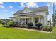 Charming two-story home with a well-manicured lawn and a welcoming front porch at 419 Mabry Rd, Angier, NC 27501