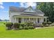 Inviting two-story home with a classic front porch, landscaped yard, and a brick pathway at 419 Mabry Rd, Angier, NC 27501