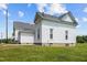 Exterior of home featuring white siding and a green lawn at 419 Mabry Rd, Angier, NC 27501