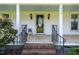 Inviting front porch with brick steps, decorative glass door, and a 'Welcome' sign at 419 Mabry Rd, Angier, NC 27501