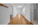 Bright hallway with hardwood flooring connecting different areas of the home at 419 Mabry Rd, Angier, NC 27501