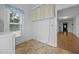A bright laundry room featuring a linoleum floor, a window and entrance to the home at 419 Mabry Rd, Angier, NC 27501