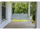 Charming porch swing provides a relaxing outdoor seating option on a traditional front porch at 419 Mabry Rd, Angier, NC 27501