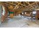 An unfinished space with exposed wooden beams and natural light allows for flexible design options at 419 Mabry Rd, Angier, NC 27501
