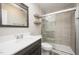 Bathroom featuring a vanity, modern glass shower, and tiled walls at 4403 Sunburst Ct, Raleigh, NC 27613