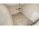 Bright bedroom with a ceiling fan, neutral paint, and vinyl floors; offers a private exterior entrance at 4403 Sunburst Ct, Raleigh, NC 27613